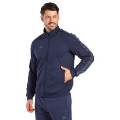 Kurtka dresowa Erima Essential Team. Niebieskie kurtki męskie Erima, s, bez wzorów, z dresówki, retro, bez ramiączek, bez kaptura. W wyprzedaży za 223.00 zł.