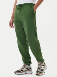 New Balance Spodnie dresowe MP41508 Zielony Relaxed Fit. Zielone spodnie dresowe męskie New Balance, bez wzorów, z bawełny. Za 359.99 zł.