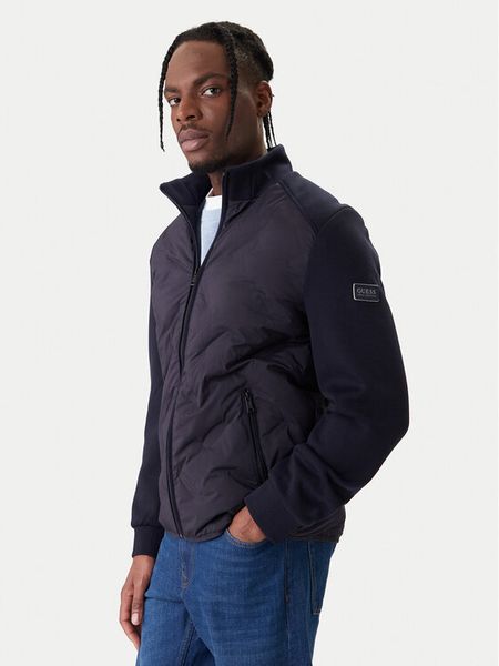 Guess Kurtka przejściowa M6RL10 WJ232 Granatowy Regular Fit. Niebieskie kurtki męskie Guess, m, z aplikacjami, z syntetyku, bez ramiączek, bez kaptura. Za 799.99 zł.