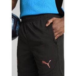 Męskie szorty treningowe Olympique Marsylia PUMA Black Copper Metallic. Czarne szorty sportowe męskie Puma, bez wzorów, sportowe. Za 190.50 zł.