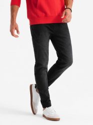 Męskie jeansowe joggery z asymetrycznymi przeszyciami – czarne V3 - Rozmiar: M. Czarne spodnie na co dzień męskie Ombre Clothing, z aplikacjami, z bawełny, casualowe. W wyprzedaży za 142.49 zł.