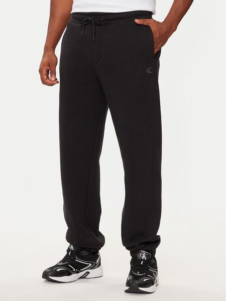 Calvin Klein Jeans Spodnie dresowe J30J326401 Czarny Relaxed Fit. Czarne spodnie dresowe męskie Calvin Klein Jeans, bez wzorów, z bawełny. Za 269.99 zł.