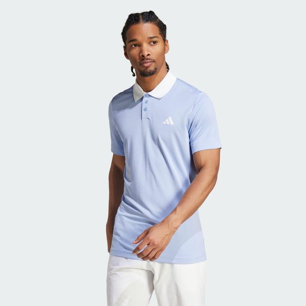 Koszulka Tennis FreeLift Polo. Niebieskie koszulki polo męskie ADIDAS, l, bez wzorów, z materiału, sportowe, bez kołnierzyka, bez ramiączek. Za 276.60 zł.