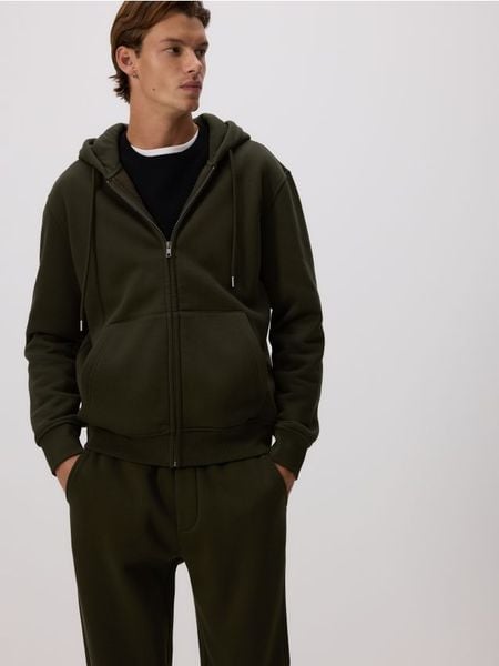 Bluza z kapturem - ciemnozielony. Zielone bluzy nierozpinane męskie Reserved, l, bez wzorów, z bawełny, bez ramiączek, z kapturem. Za 129.99 zł.