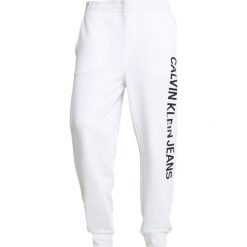Calvin Klein Jeans INSTITUTIONAL SIDE PANTS Spodnie treningowe white. Długie spodnie sportowe męskie Calvin Klein Jeans. Za 419.00 zł.