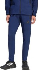 Adidas Spodnie męskie adidas Tiro 26 Travel Woven granatowe KE8364 2XL. Długie spodnie sportowe męskie ADIDAS, bez wzorów. Za 278.99 zł.