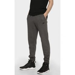 Spodnie dresowe męskie SPMD300 - ciemny szary melanż. Spodnie dresowe męskie marki 4f. Za 119.99 zł.