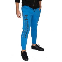 Spodnie dresowe męskie Under Armour. Niebieskie spodnie na co dzień męskie Under Armour, bez wzorów, z dresówki, sportowe. Za 156.60 zł.