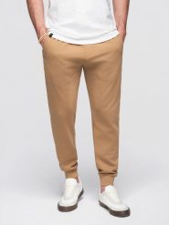 Spodnie męskie dresowe typu jogger - brązowe V2 - Rozmiar: S. Brązowe spodnie dresowe męskie Ombre Clothing, bez wzorów, z bawełny. W wyprzedaży za 101.24 zł.