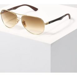 RayBan Okulary przeciwsłoneczne gold/crystal brown gradient. Żółte okulary przeciwsłoneczne męskie Ray-Ban, w gradientowe wzory. Za 859.00 zł.