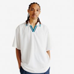 Koszulka polo oversize męska Heritage. Białe koszulki polo męskie Decathlon, m, bez wzorów, z materiału, klasyczne, bez kołnierzyka, bez ramiączek. Za 89.99 zł.