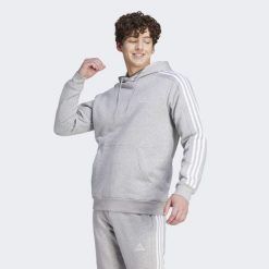 Bluza męska adidas Essentials Fleece 3-Stripes Hoodie. Białe bluzy z polaru męskie ADIDAS, m, bez wzorów, z materiału, sportowe, bez ramiączek, z kapturem. Za 219.00 zł.