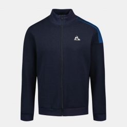 Bluza zapinana na zamek błyskawiczny Le Coq Sportif Heritage SP N°1. Niebieskie bluzy rozpinane męskie le coq sportif, m, bez wzorów, sportowe, bez ramiączek, z kapturem. W wyprzedaży za 310.95 zł.