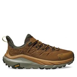 Trekkingi Hoka. Brązowe buty trekkingowe męskie HOKA, bez wzorów, z gore-texu, sportowe, bez obcasa, bez zapięcia. Za 629.99 zł.