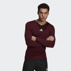 Koszulka piłkarska męska adidas Team Base Tee. Fioletowe bielizna termoaktywna męska ADIDAS, m, bez wzorów, z poliesteru, bez ramiączek, do piłki nożnej. Za 69.00 zł.