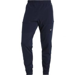 Nike Performance PANT RUN DIVISION Spodnie treningowe obsidian/silver. Długie spodnie sportowe męskie Nike Performance. W wyprzedaży za 342.30 zł.