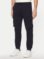 Guess Spodnie dresowe Z4YB08 K9V31 Granatowy Regular Fit. Niebieskie spodnie dresowe męskie Guess, z aplikacjami, z bawełny. Za 319.99 zł.