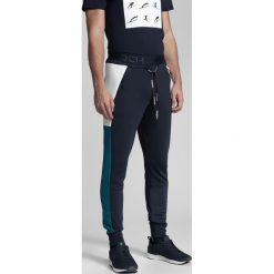 Spodnie dresowe męskie Kamil Stoch Collection SPMD500 - granat. Spodnie dresowe męskie marki 4f. W wyprzedaży za 149.99 zł.