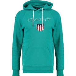 GANT SHIELD HOODIE Bluza z kapturem emerald green. Bluzy nierozpinane męskie marki Gant. W wyprzedaży za 356.15 zł.