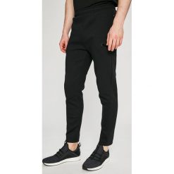 Puma - Spodnie. Długie spodnie sportowe męskie marki Puma. W wyprzedaży za 229.90 zł.
