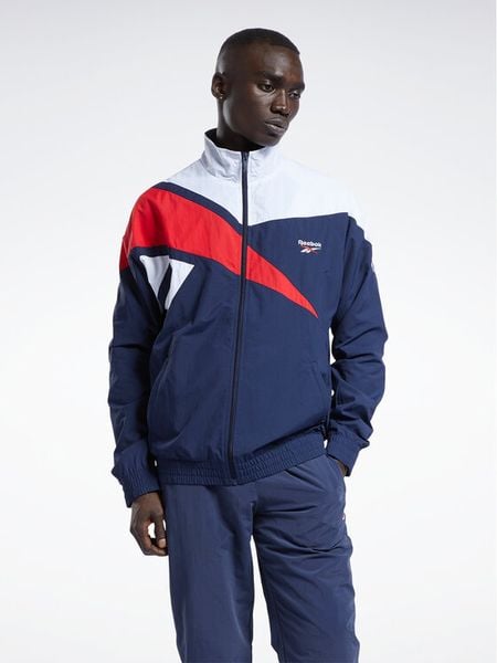 Reebok Bluza Classics Vector Track Top H54456 Niebieski Regular Fit. Niebieskie bluzy rozpinane męskie Reebok, m, bez wzorów, z syntetyku, bez ramiączek, bez kaptura. Za 179.99 zł.