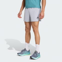 Szorty Adi365 Running CLIMACOOL+. Szare szorty sportowe męskie ADIDAS, bez wzorów, sportowe. W wyprzedaży za 202.02 zł.