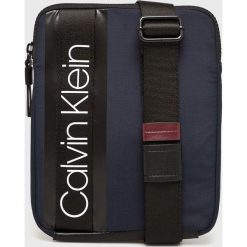 Calvin Klein - Saszetka. Czarne saszetki męskie Calvin Klein, w paski, z materiału. Za 299.90 zł.