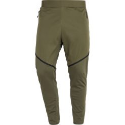 Nike Performance Spodnie treningowe olive/black. Długie spodnie sportowe męskie marki Nike Performance. Za 509.00 zł.