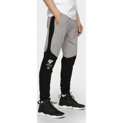 Spodnie dresowe męskie SPMD205 - szary melanż. Spodnie dresowe męskie marki 4f. Za 149.99 zł.