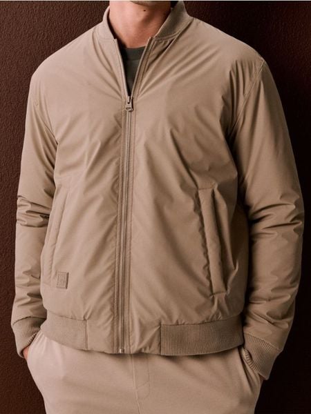 Kurtka bomberka - beżowy. Brązowe kurtki męskie Sinsay, l, bez wzorów, bez ramiączek, bez kaptura. Za 89.99 zł.