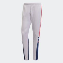 Spodnie piłkarskie ADIDAS Squadra 25 treningowe. Niebieskie długie spodnie sportowe męskie ADIDAS, bez wzorów. Za 129.99 zł.