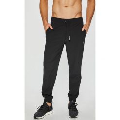 Calvin Klein Performance - Spodnie. Szare długie spodnie sportowe męskie Calvin Klein Performance, z elastanu. Za 269.90 zł.