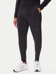 Adidas Spodnie dresowe Designed for Training Hybrid IY1123 Czarny Slim Fit. Czarne długie spodnie sportowe męskie ADIDAS, bez wzorów, z dresówki, na fitness i siłownię. Za 279.99 zł.
