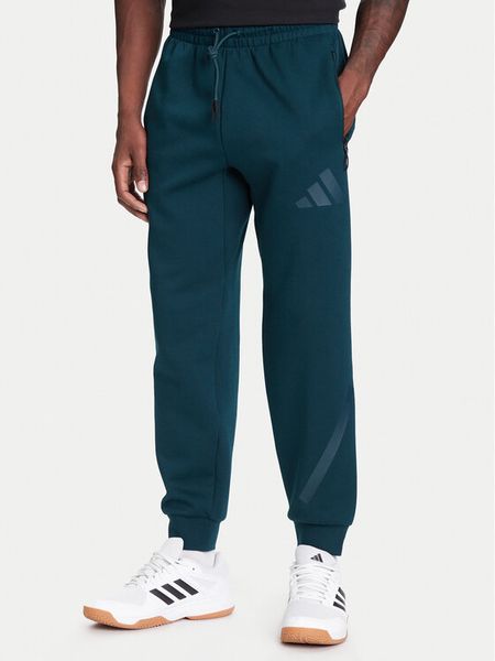 Adidas Spodnie dresowe Z.N.E. JW4724 Zielony Loose Fit. Zielone spodnie dresowe męskie ADIDAS, bez wzorów, z bawełny. Za 269.99 zł.