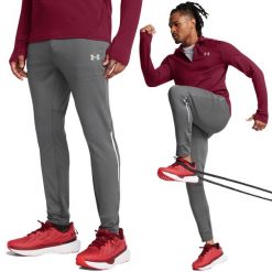 Spodnie treningowe męskie Under Armour wygodne dresowe do ćwiczeń. Szare długie spodnie sportowe męskie Under Armour, na jesień, bez wzorów, z dresówki. W wyprzedaży za 262.95 zł.