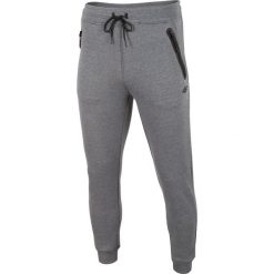 Spodnie dresowe męskie SPMD004 - średni szary melanż. Spodnie dresowe męskie marki 4f. Za 149.99 zł.