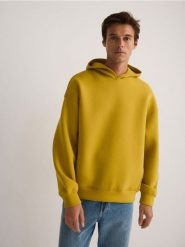 Gładka bluza z kapturem - żółty. Żółte bluzy nierozpinane męskie Reserved, l, bez wzorów, z bawełny, bez ramiączek, z kapturem. W wyprzedaży za 69.99 zł.