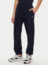 Champion Spodnie dresowe 220709 Granatowy Relaxed Fit. Niebieskie spodnie dresowe męskie CHAMPION, bez wzorów, z bawełny. Za 239.99 zł.