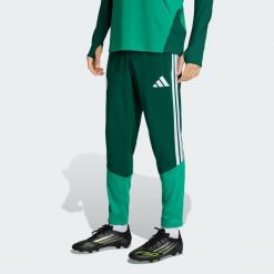 Spodnie treningowe Algeria 26. Zielone długie spodnie sportowe męskie ADIDAS, bez wzorów, z dresówki, do piłki nożnej. Za 279.00 zł.