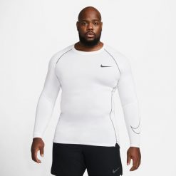 Koszulka Męska Termoaktywna Nike Pro Tight Compression. Białe bielizna termoaktywna męska Nike, m, bez wzorów, bez ramiączek, do piłki nożnej. W wyprzedaży za 158.35 zł.