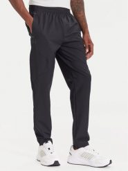 Under Armour Spodnie dresowe Unstoppable 6003861 Czarny Loose Fit. Czarne spodnie dresowe męskie Under Armour, bez wzorów, z dresówki. Za 299.99 zł.