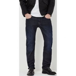 Dżinsy "Attacc" - Straight fit - w kolorze granatowym. Niebieskie jeansy męskie G-Star, z aplikacjami, z bawełny, klasyczne. W wyprzedaży za 285.95 zł.