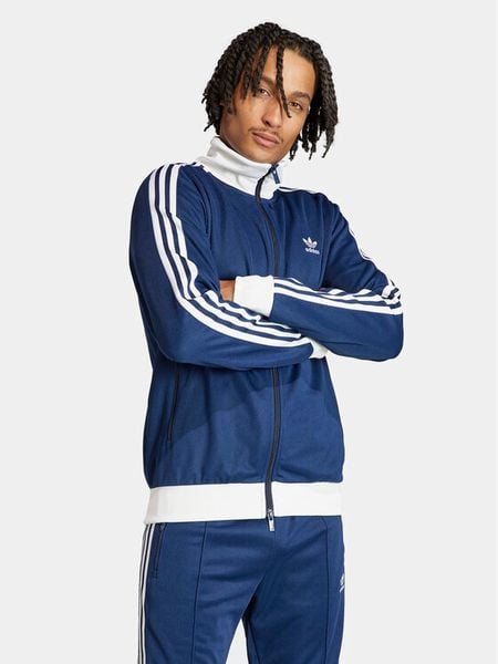 Adidas Bluza adicolor Classics Beckenbauer IP0418 Niebieski Slim Fit. Niebieskie bluzy nierozpinane męskie ADIDAS, m, bez wzorów, z syntetyku, bez ramiączek, bez kaptura. Za 199.99 zł.