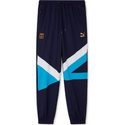 Spodnie "Olympique Marseille" w kolorze granatowym. Długie spodnie sportowe męskie Puma. W wyprzedaży za 108.95 zł.