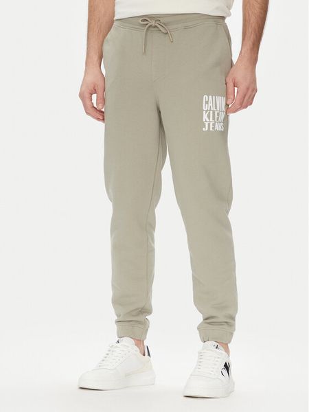 Calvin Klein Jeans Spodnie dresowe Painted J30J327535 Zielony Regular Fit. Zielone spodnie dresowe męskie Calvin Klein Jeans, bez wzorów, z bawełny. Za 229.99 zł.