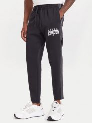 Under Armour Spodnie dresowe Ua Rival Fleece Colorblock 6003954 Czarny Loose Fit. Czarne spodnie dresowe męskie Under Armour, bez wzorów, z bawełny. Za 249.99 zł.