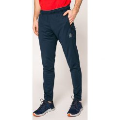 Reebok - Spodnie. Szare spodnie dresowe męskie marki Reebok, z dzianiny. W wyprzedaży za 159.90 zł.