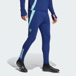 Spodnie Arsenal Tiro 24 Training. Niebieskie spodnie dresowe męskie ADIDAS, bez wzorów, z materiału. Za 355.96 zł.