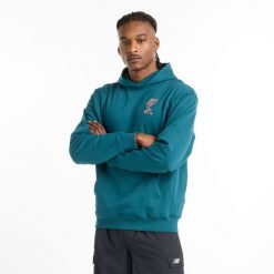 Bluza męska New Balance MT51979DOE – niebieska. Niebieskie bluzy nierozpinane męskie New Balance, m, bez wzorów, z bawełny, klasyczne, bez ramiączek, z kapturem. Za 269.99 zł.