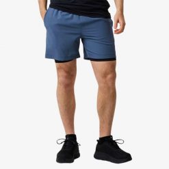 Szorty treningowe Trening Męska Swedemount Core 2-In-1 Shorts szybkoschnące. Niebieskie szorty sportowe męskie SWEDEMOUNT, bez wzorów, sportowe. Za 169.99 zł.